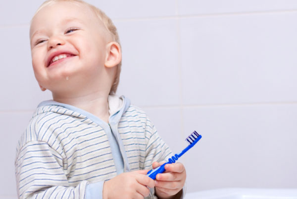child brushing teeth