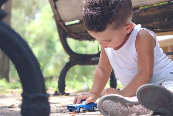 little boy playing in dirt